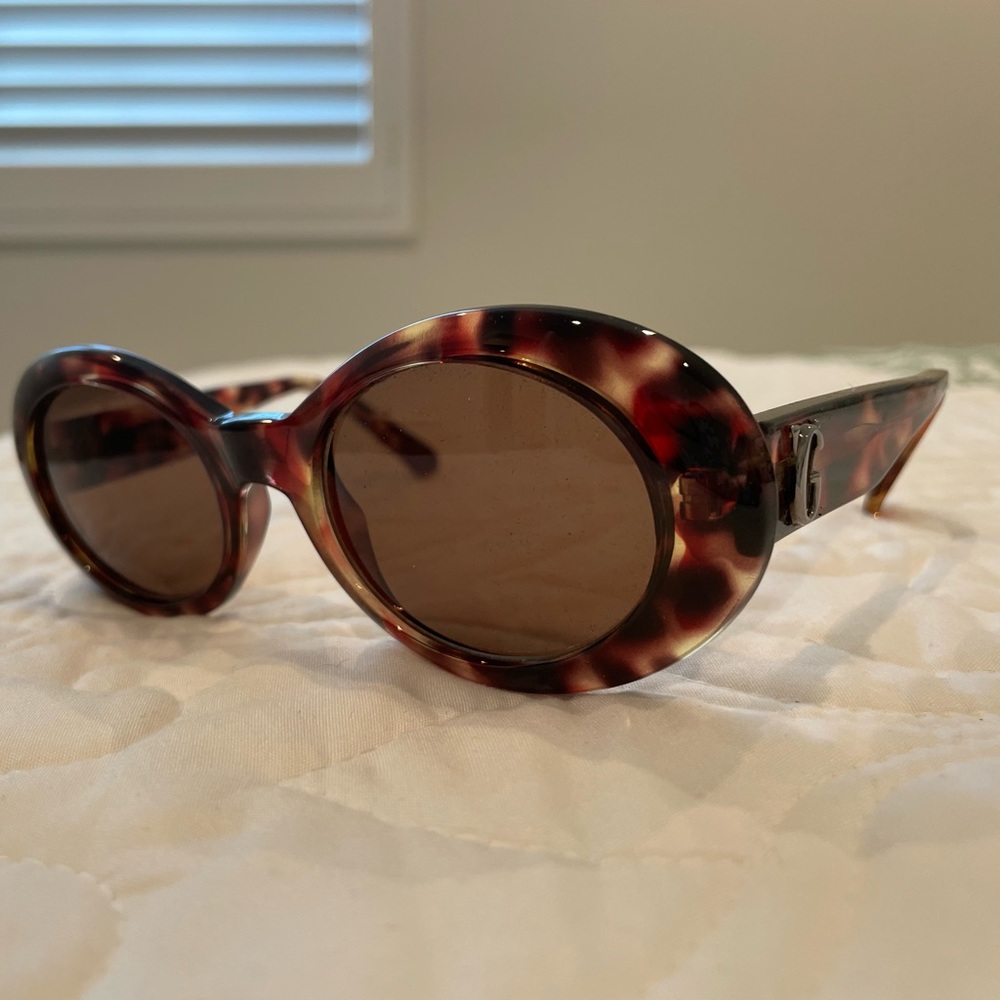 Gianni Versace sunglasses. Brown/multi with hints of red. about 6 in. Wide